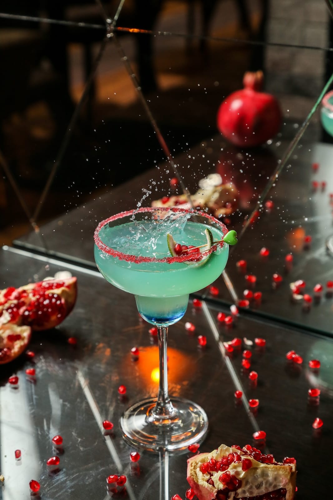 blue-cocktail-with-pomegranate-and-syrup-side-view-2023-11-27-05-14-05-utc